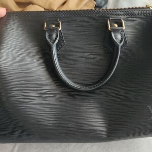 Sleek Black Handbag with Gold Zipper